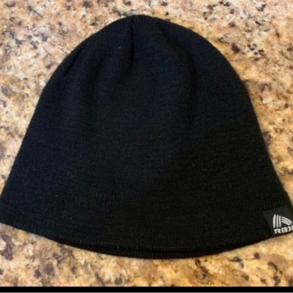 “RBX” Black Unisex Beanie. One Size Fits Most. Material: 100% Acrylic.